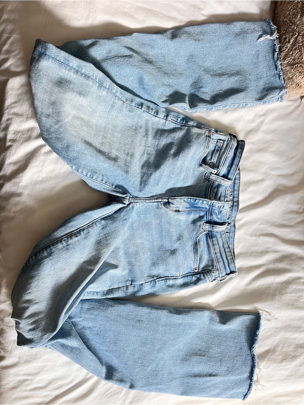 Light Wash high rise ripped jeans with slits on ankle